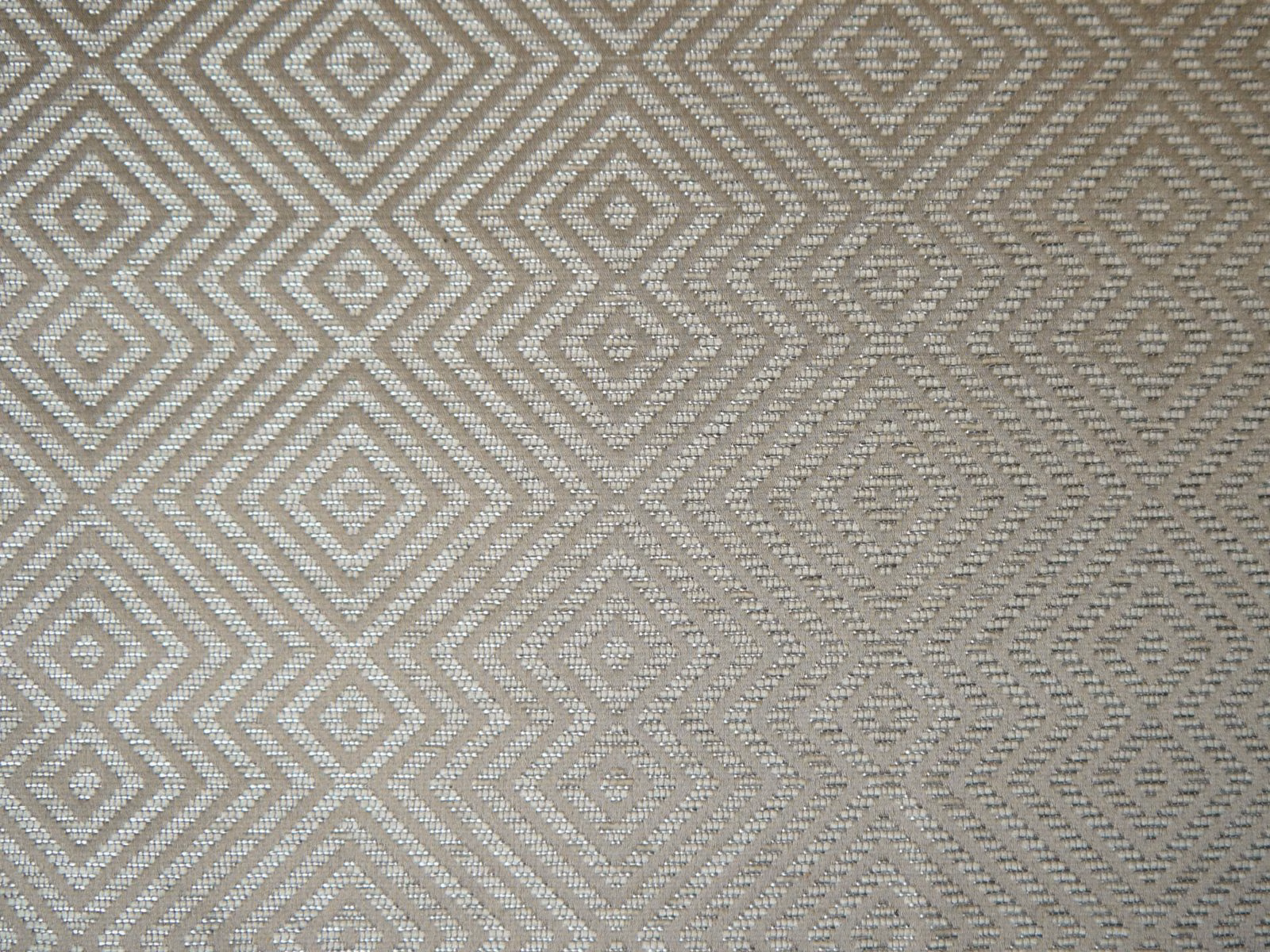 Warm greige chenille with ivory diamond and chevron geometry in close view
