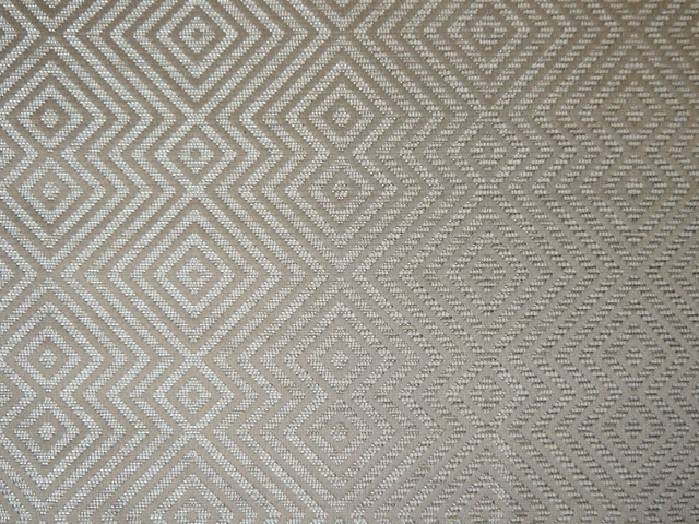 Warm greige chenille with ivory diamond and chevron geometry in close view