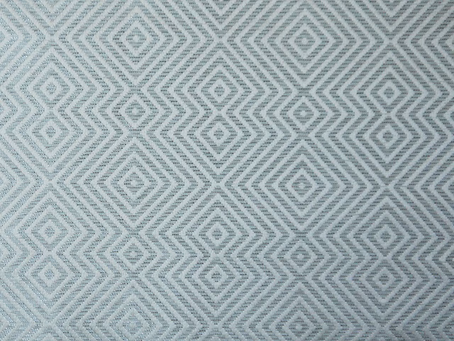 Pale blue-grey chenille with repeated stepped diamond motifs and textured weave