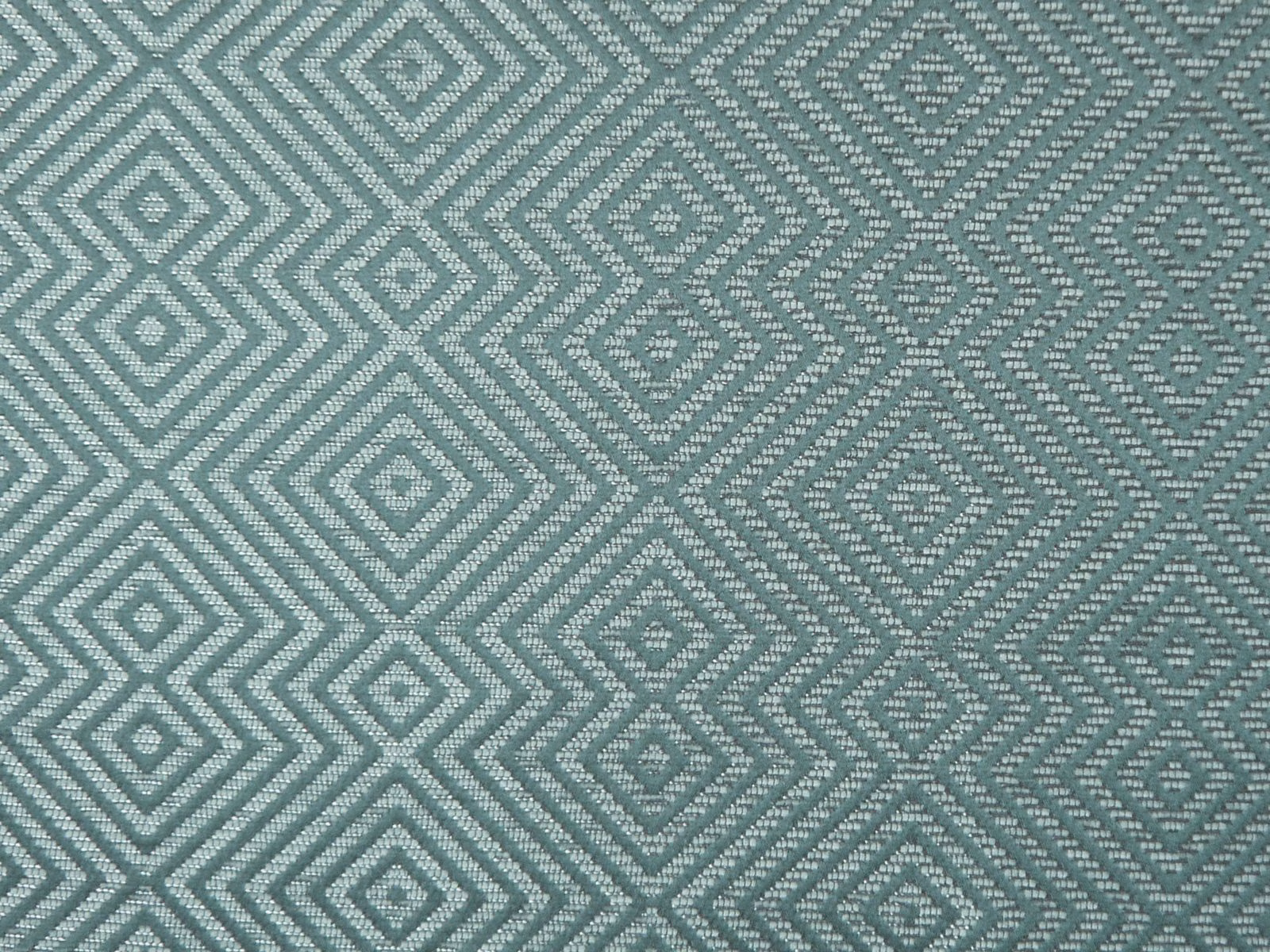 Muted blue-teal chenille with repeating diamond and zigzag geometric weave