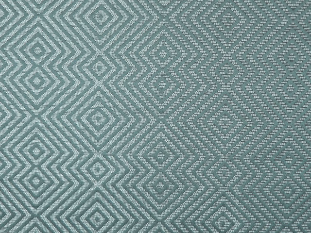 Muted blue-teal chenille with repeating diamond and zigzag geometric weave