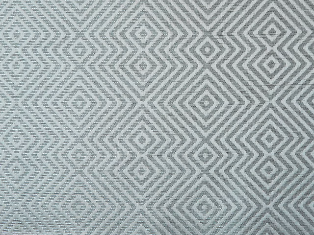 Cool blue-grey chenille with repeating diamond and chevron weave texture