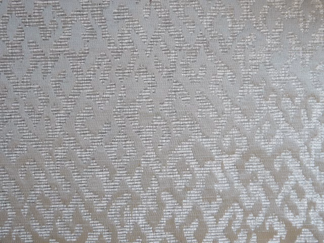 Silver-grey chenille with a raised, softly looping organic pattern