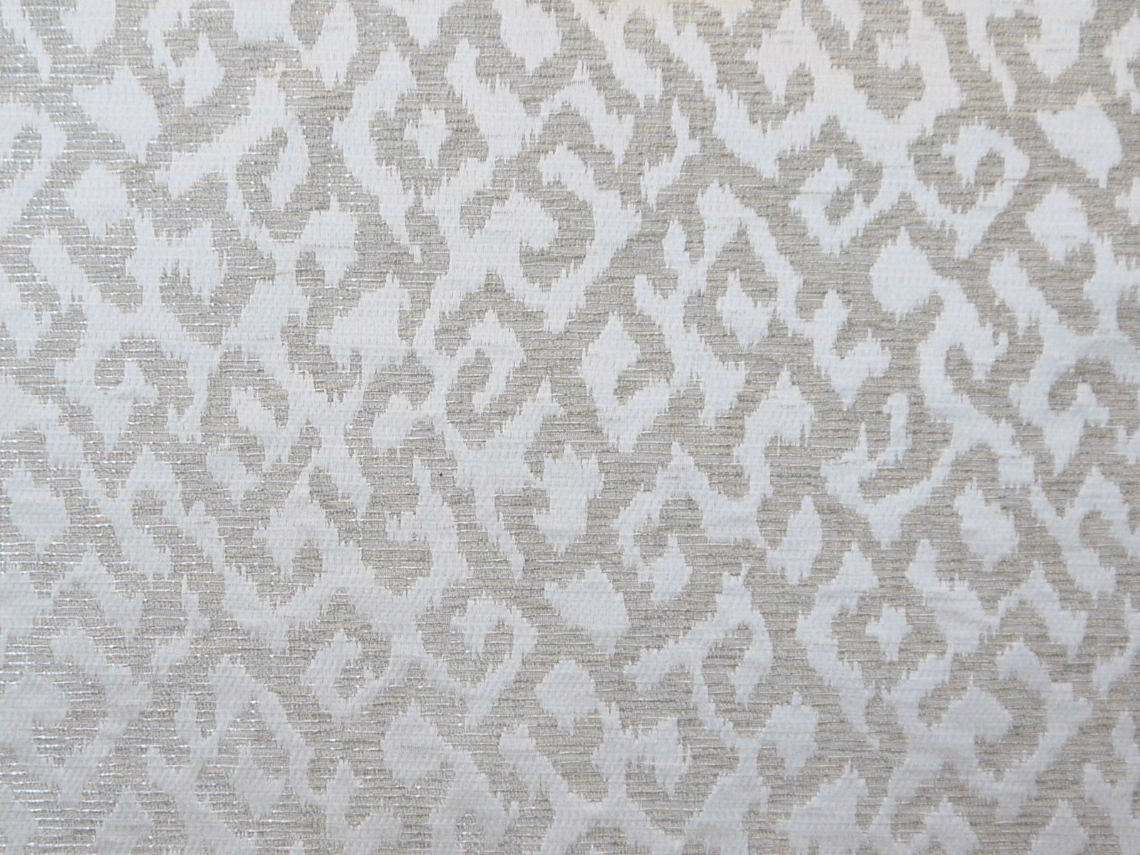 Pale greige chenille with a broken taupe-grey abstract woven motif