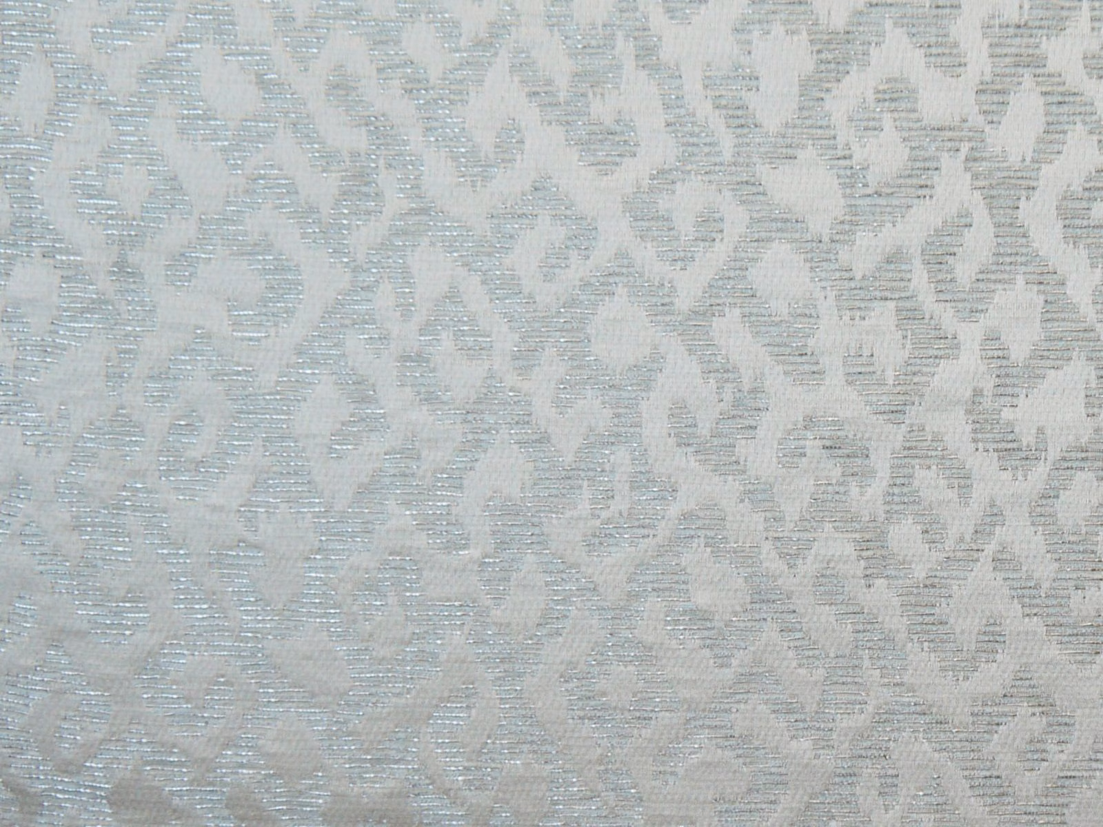 Pale blue-grey chenille with a softly broken geometric pattern and ridged texture