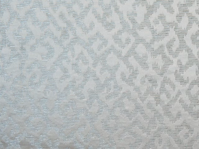 Pale blue-grey chenille with a softly broken geometric pattern and ridged texture