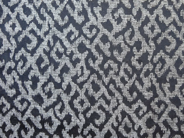 Charcoal and silver-grey chenille with a dense irregular woven motif
