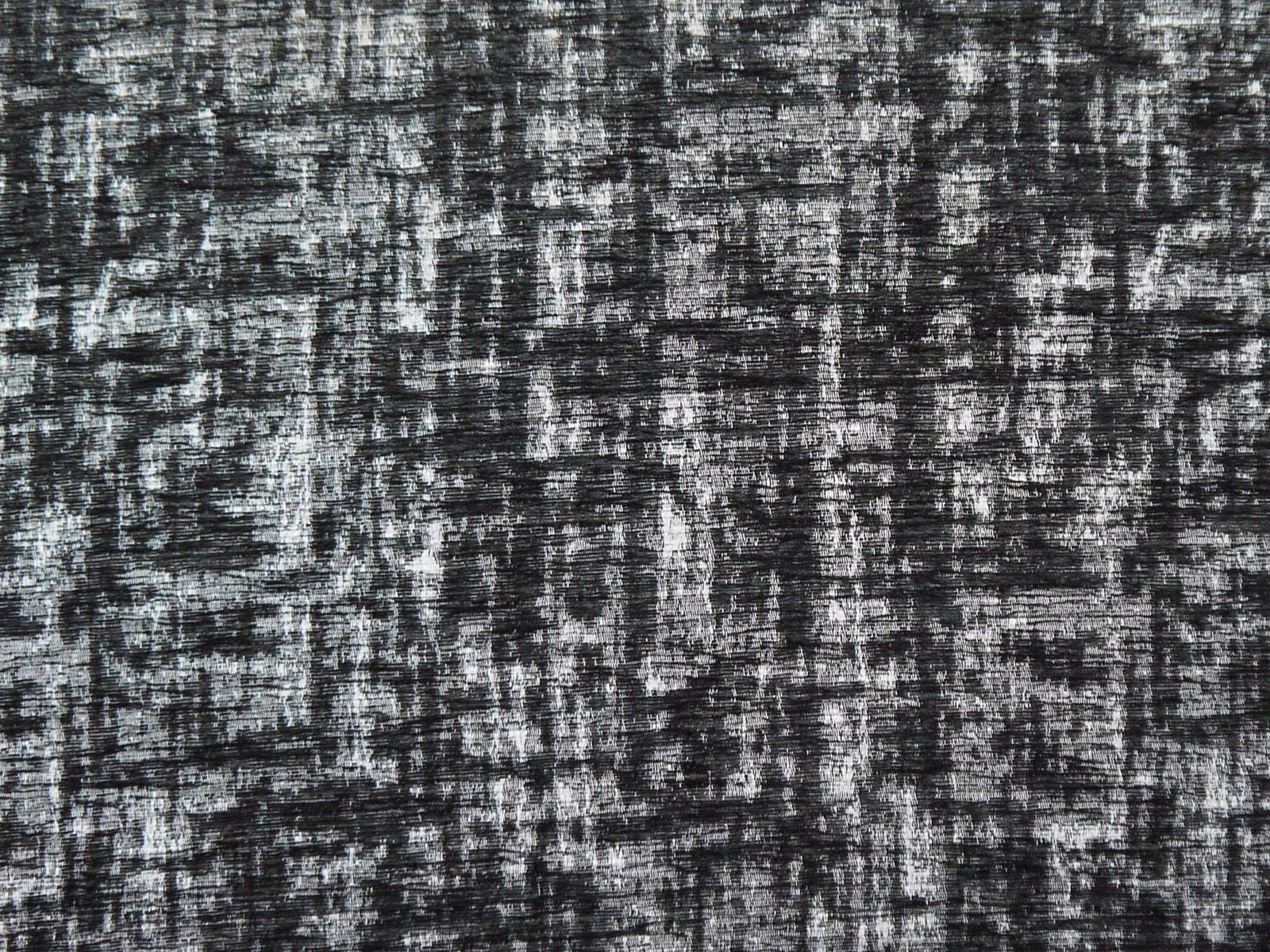 Charcoal chenille with silver-grey broken striations and a dense tactile weave
