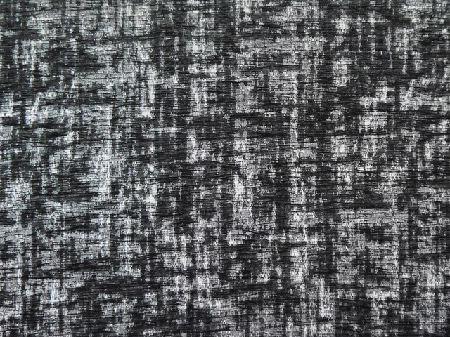 Charcoal chenille with silver-grey broken striations and a dense tactile weave