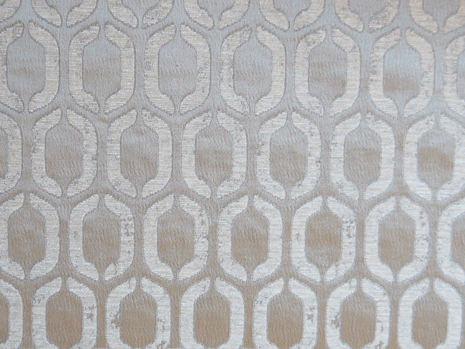 Pale silver-grey chenille with repeating taupe lantern motifs and textured weave