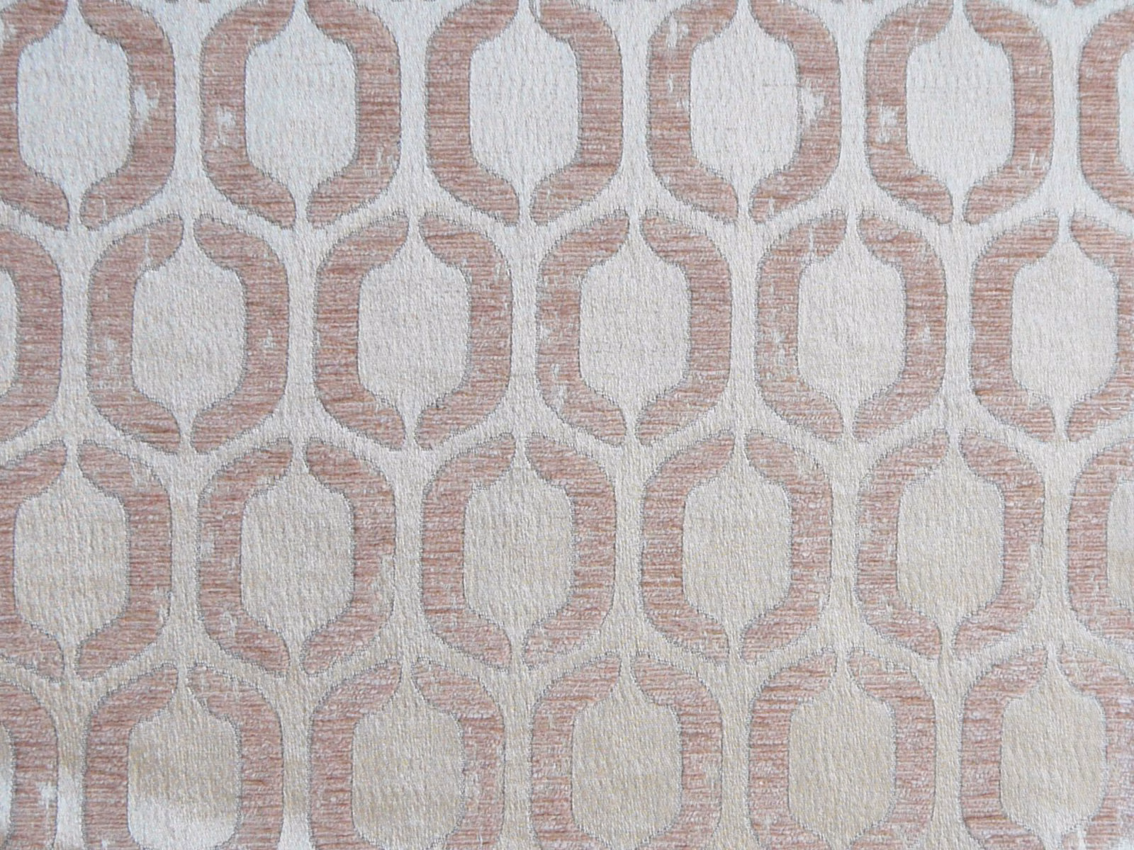 Dusty blush pink chenille with ivory linked geometric motifs and a softly ridged weave