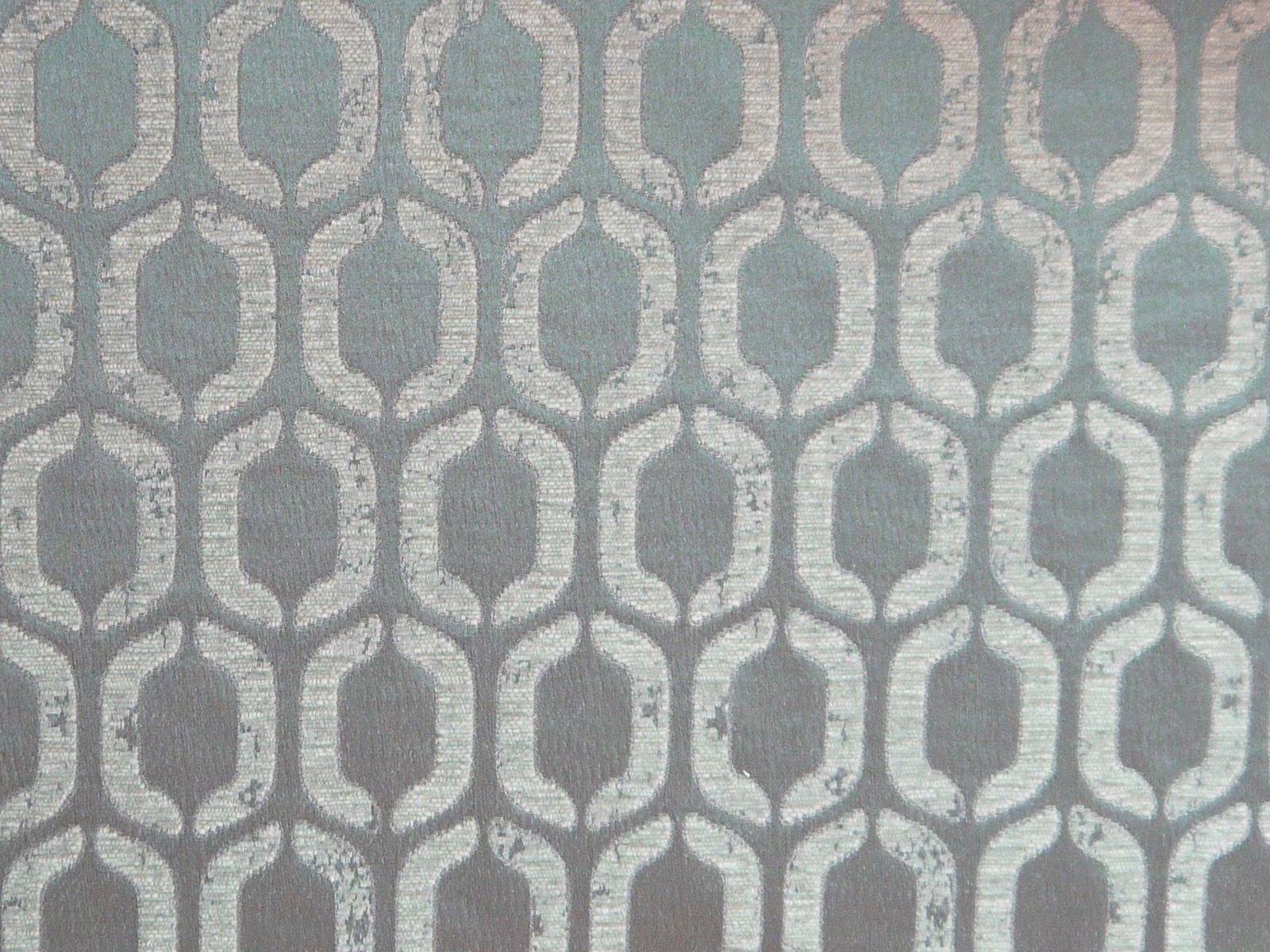 Muted sage-blue chenille with silver-grey linked oval lattice motif