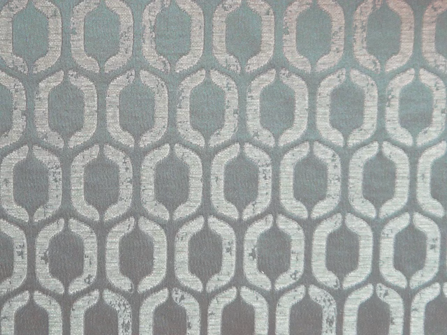 Muted sage-blue chenille with silver-grey linked oval lattice motif