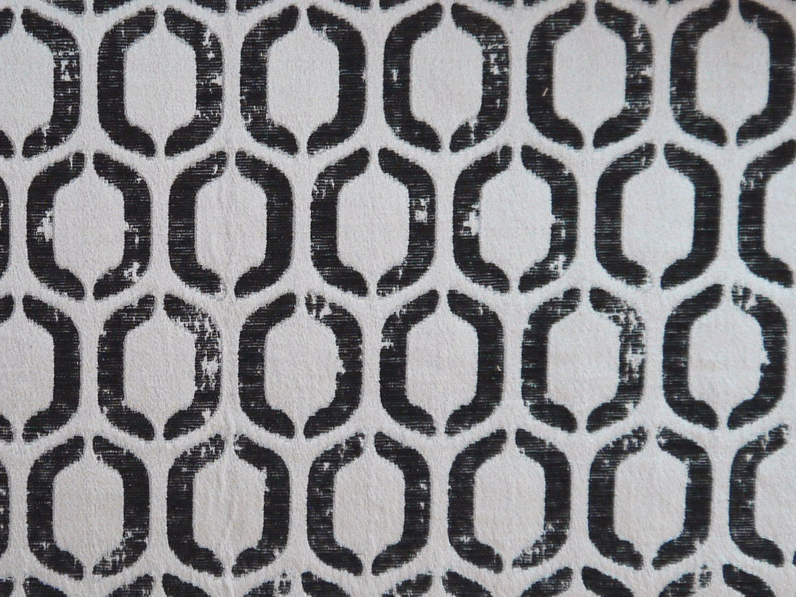 Charcoal rounded lattice pattern on a softly textured pale grey chenille ground