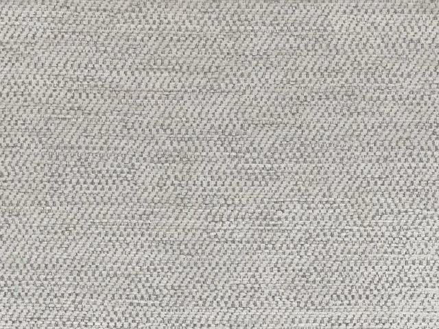 Close-up of softly mottled pale grey chenille with a fine woven texture