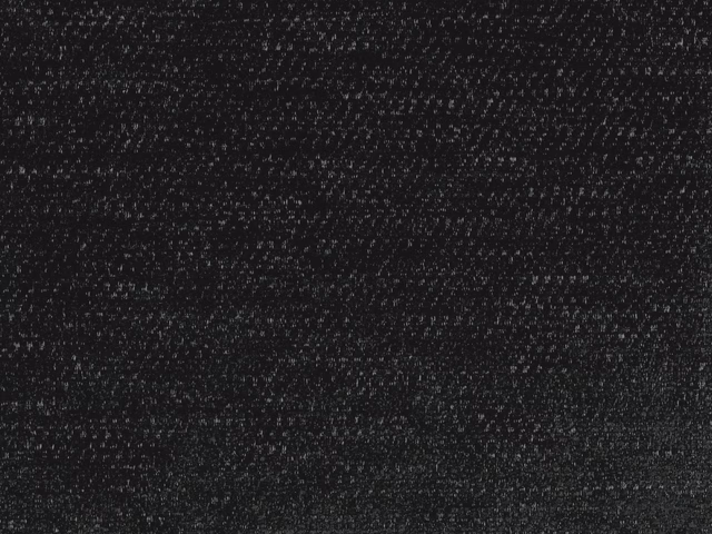 Near-black charcoal chenille with fine pale flecks and a softly mottled weave.