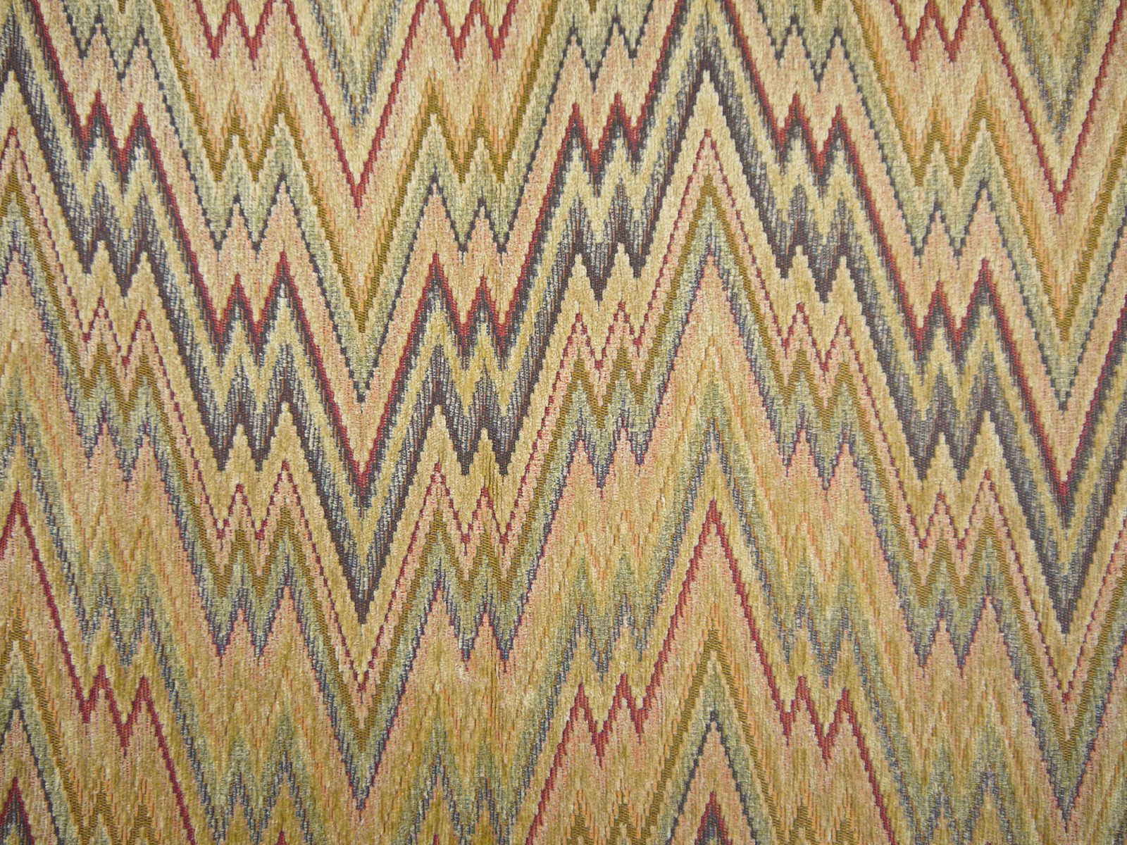 Muted olive chenille with ochre, burgundy and charcoal repeating zigzag weave
