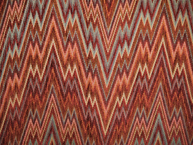 Rust and burgundy chenille with cream and muted teal zigzag chevrons
