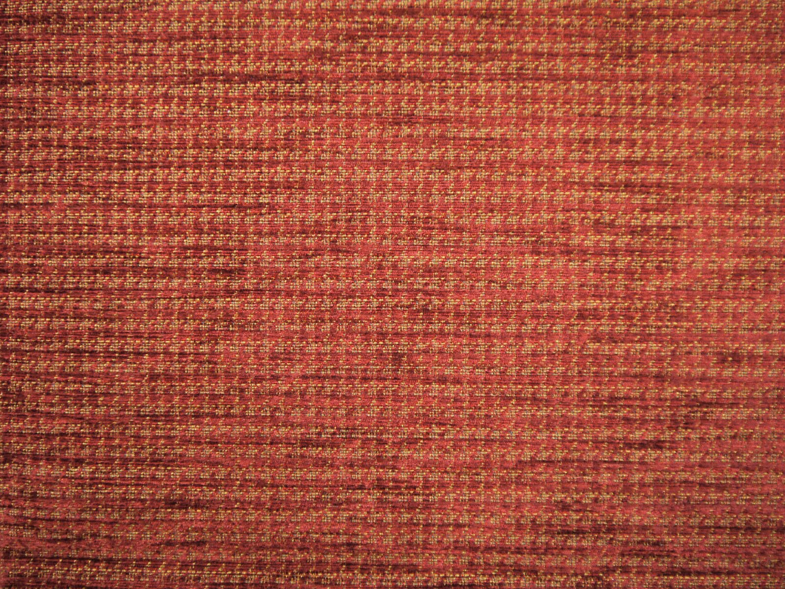 Close-up of red-burgundy chenille with russet and gold horizontal woven flecks