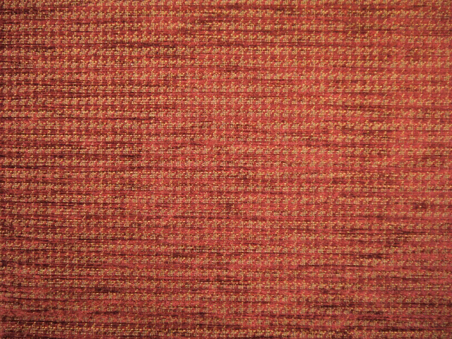 Close-up of red-burgundy chenille with russet and gold horizontal woven flecks