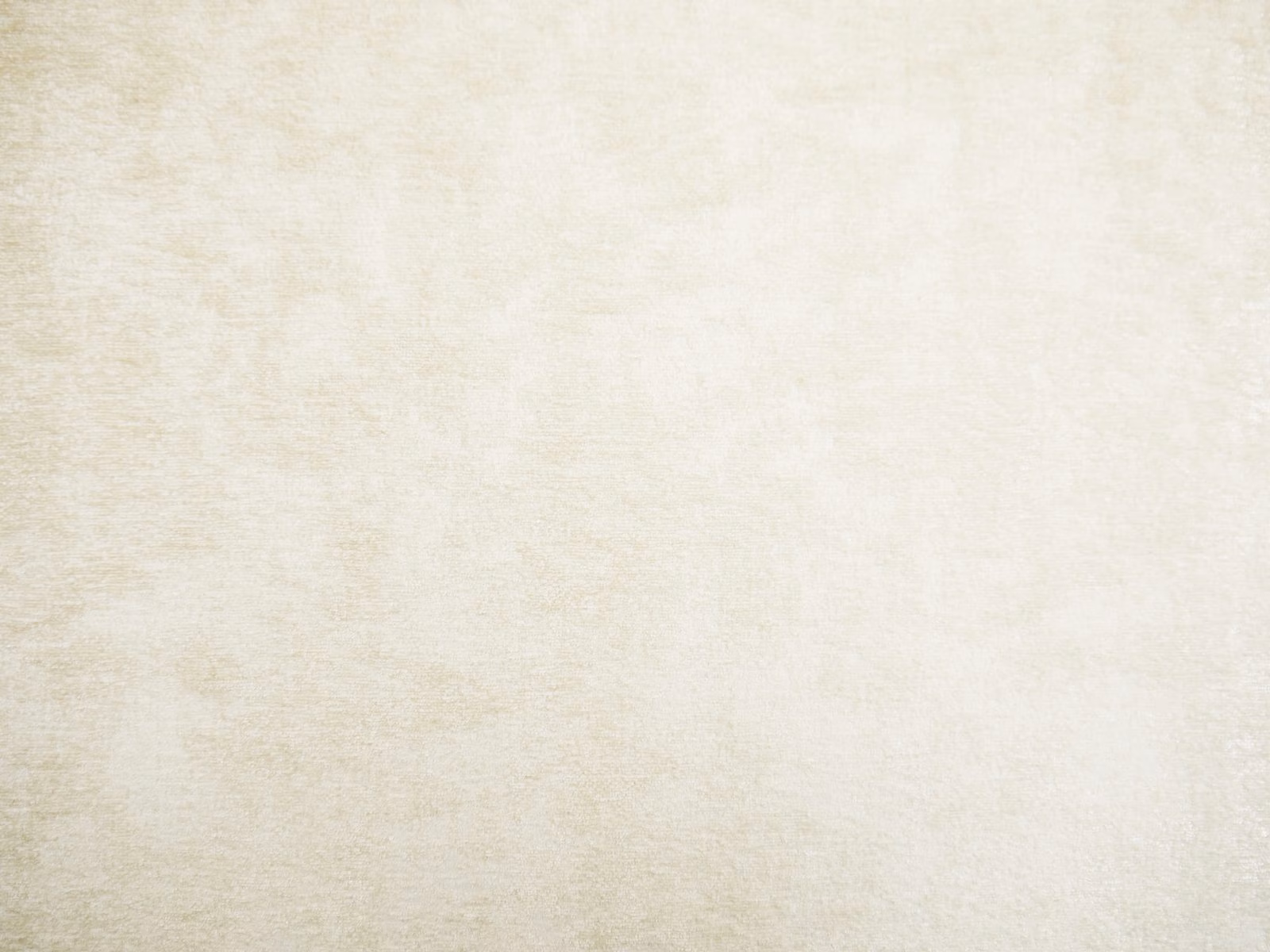 Soft ivory cream chenille swatch with subtle mottled texture and warm tonal variation