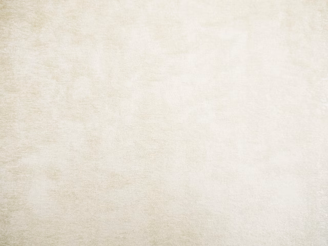Soft ivory cream chenille swatch with subtle mottled texture and warm tonal variation