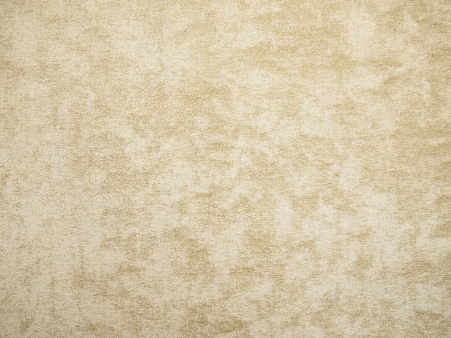 Warm parchment-beige chenille with cloudy ivory and taupe mottling across the surface