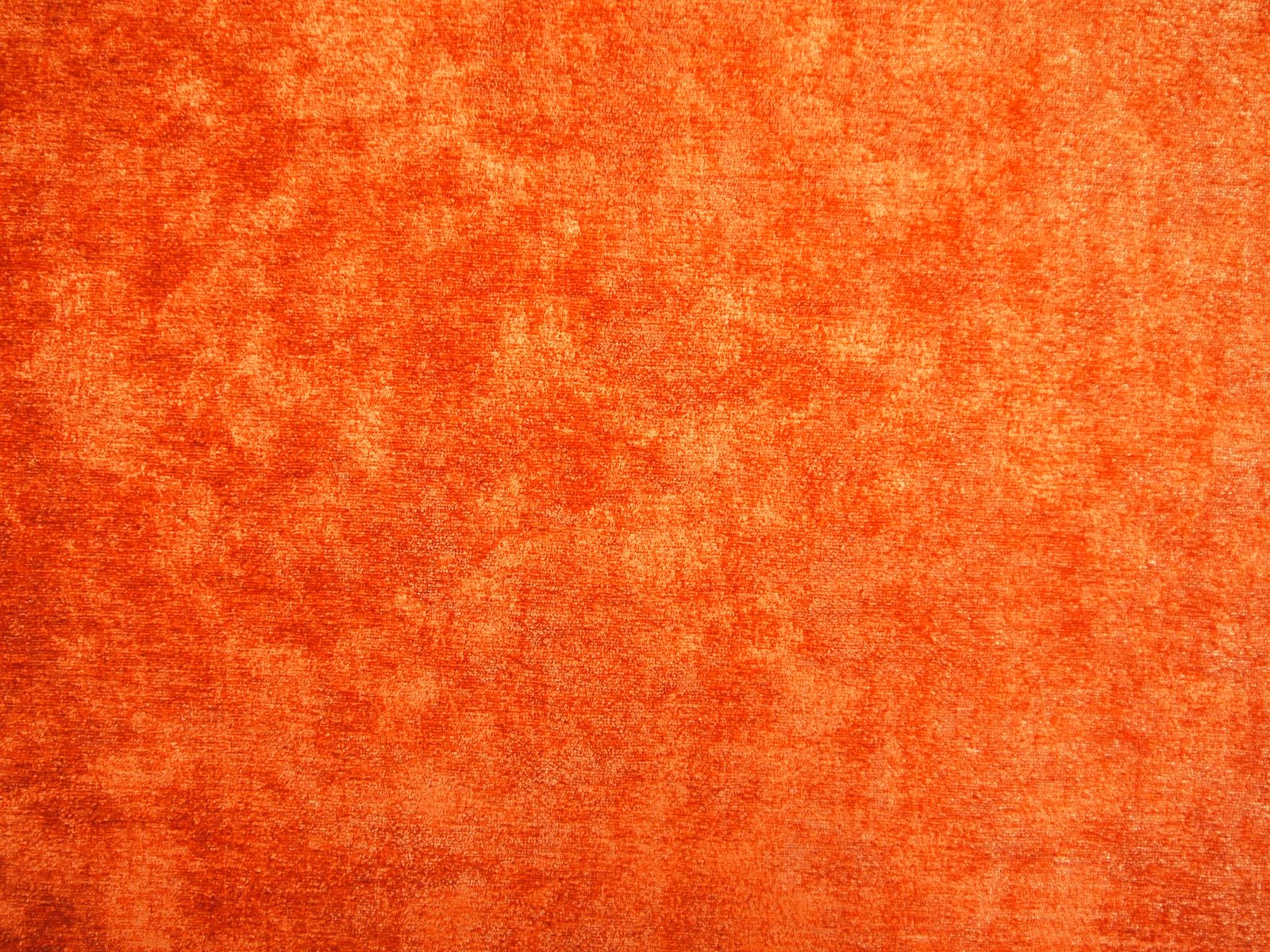 Burnt coral orange chenille with mottled rust shading and softly brushed texture
