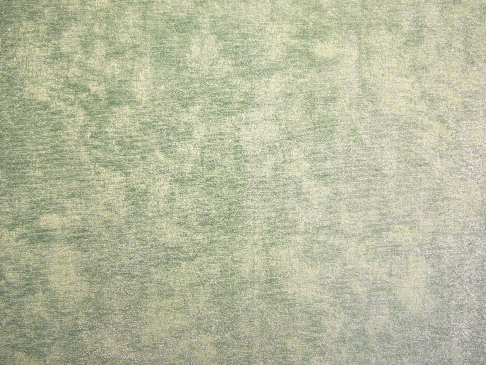 Pale sage green chenille with cloudy mottling and a fine horizontal woven texture