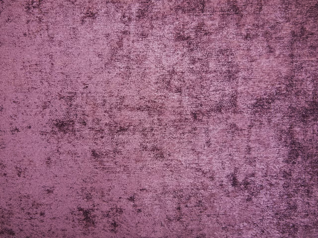 Mottled mauve-plum chenille with dark cloudy marks and a soft brushed surface