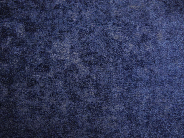 Deep indigo chenille with cloudy blue-violet mottling and softly raised texture
