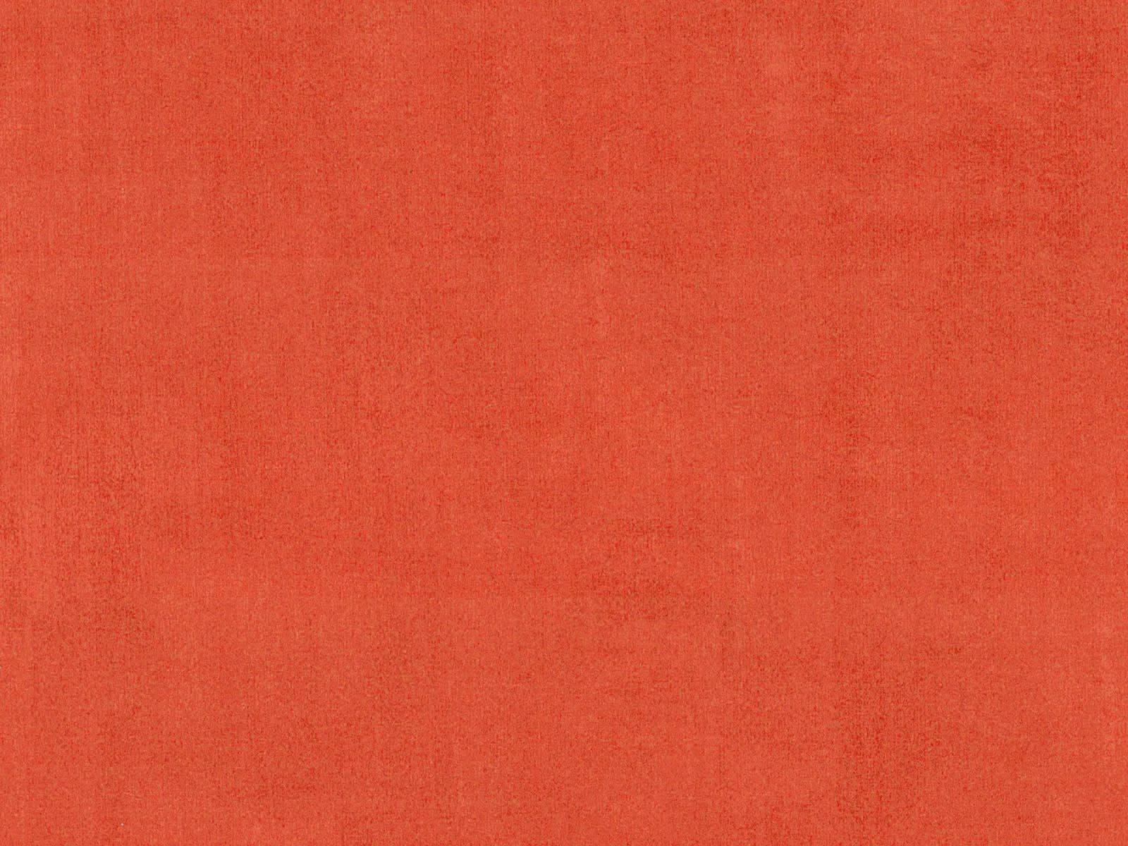 Warm coral-red velvet with a softly varied nap and plain surface