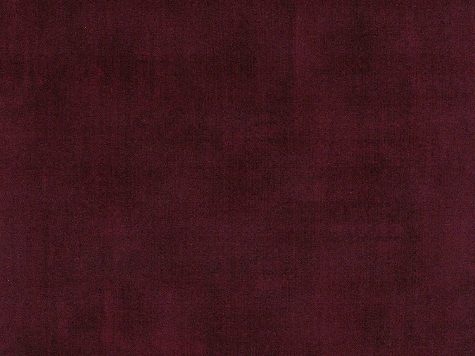 Deep burgundy velvet with subtle tonal nap and muted plum shading