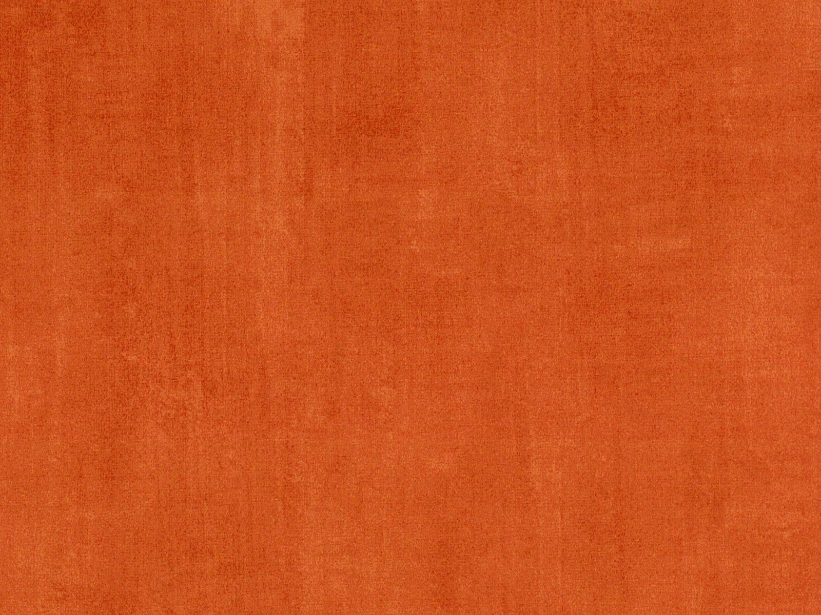 Burnt terracotta orange velvet with subtle vertical pile and tonal surface variation