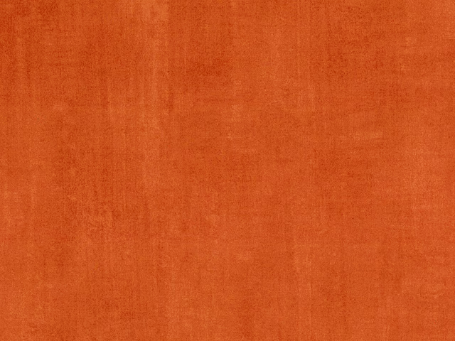 Burnt terracotta orange velvet with subtle vertical pile and tonal surface variation