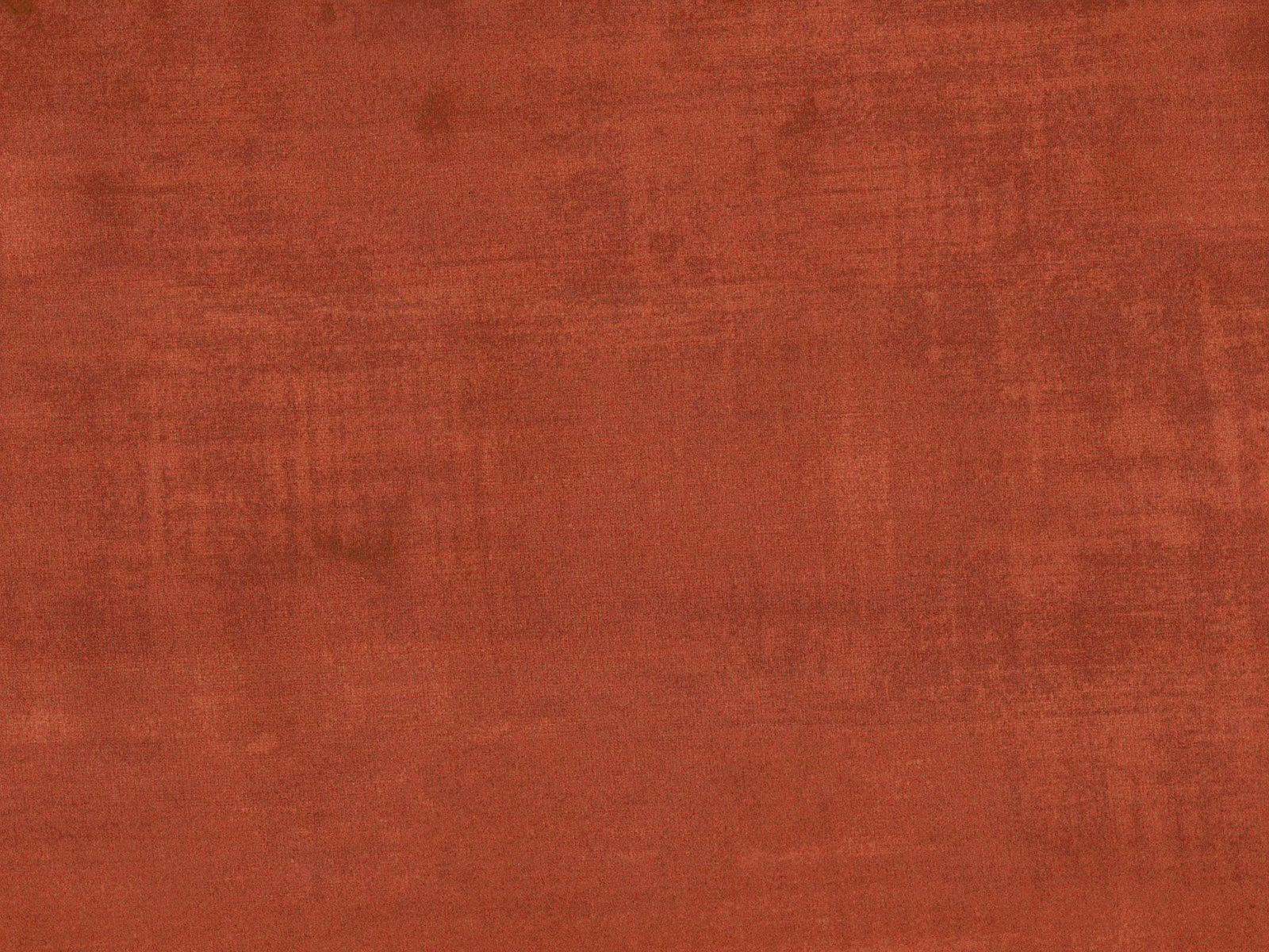 Deep rust-terracotta velvet with softly brushed nap and subtle tonal striations