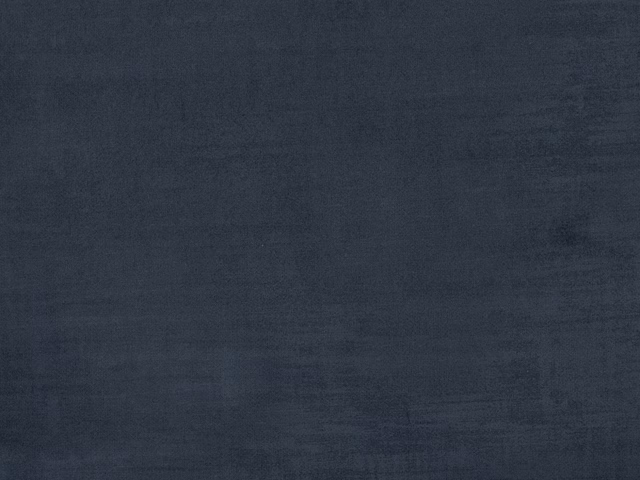 Close-up of dark charcoal-blue velvet with soft brushed tonal texture