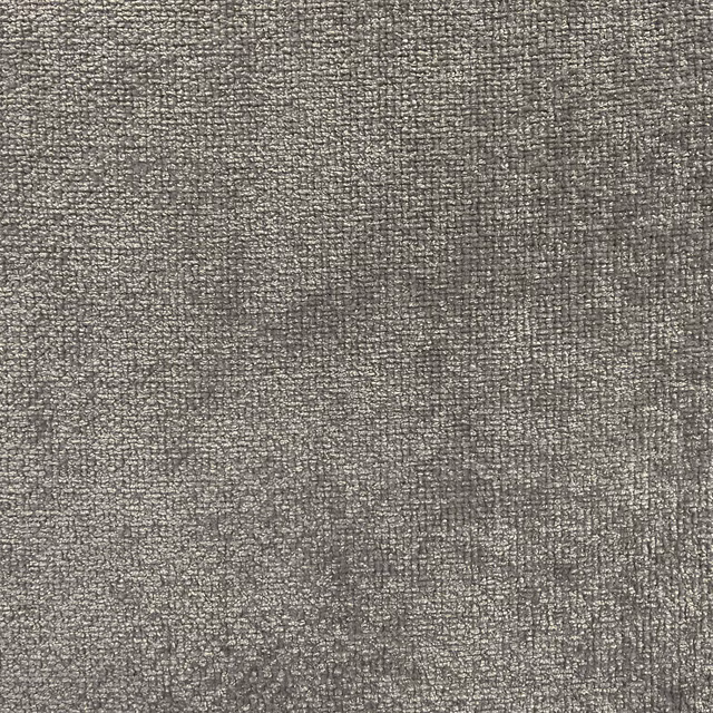 Close-up of mottled taupe-grey chenille with a dense, softly textured weave