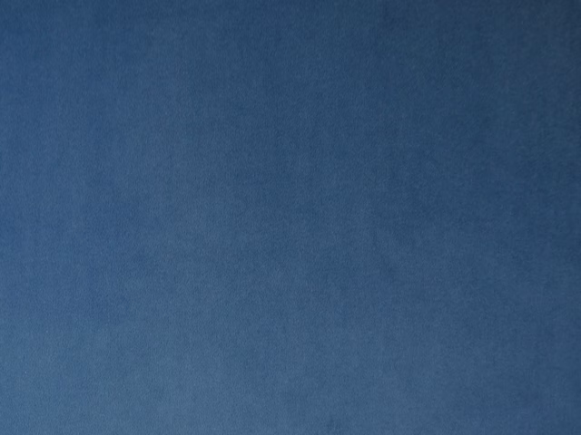 Deep slate-blue velvet swatch with soft directional nap and subtle tonal shading