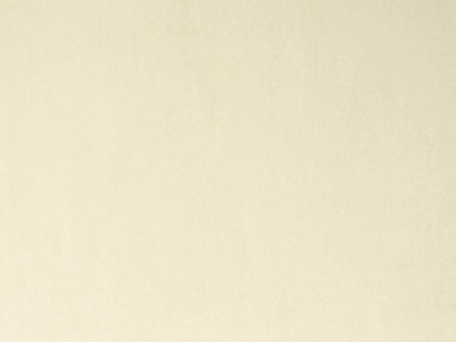 Pale ivory cream velvet with a softly mottled nap and subtle light-catching sheen