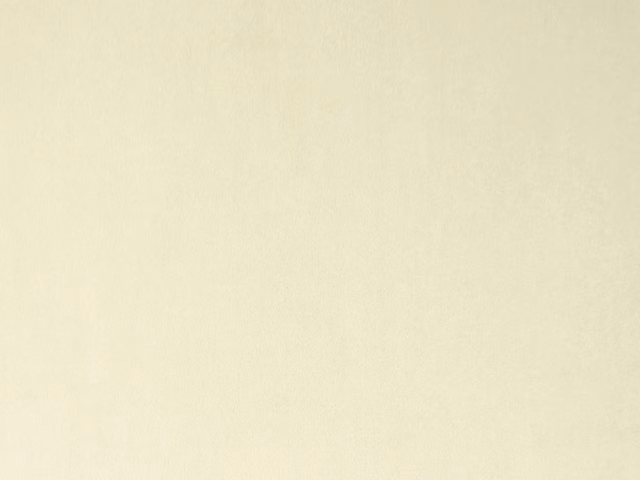 Pale ivory cream velvet with a softly mottled nap and subtle light-catching sheen
