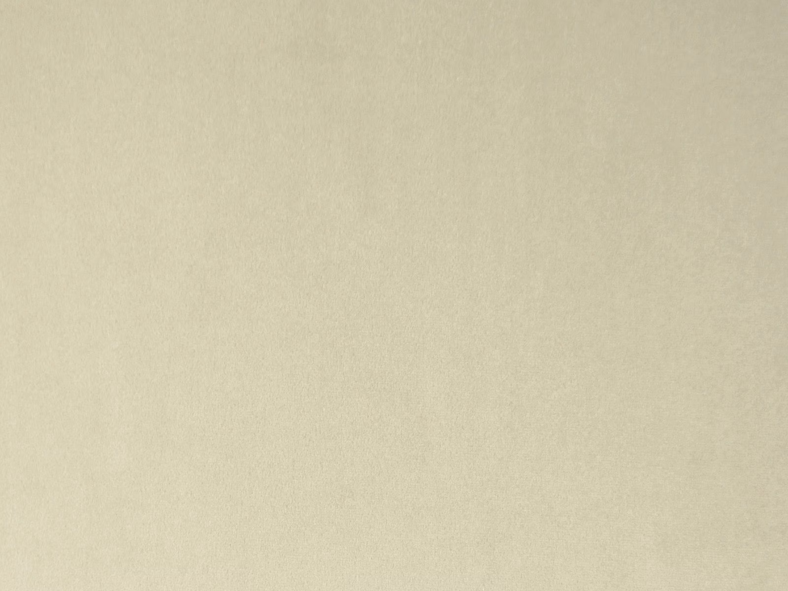 Pale warm-beige plain velvet with a softly mottled, light-catching pile
