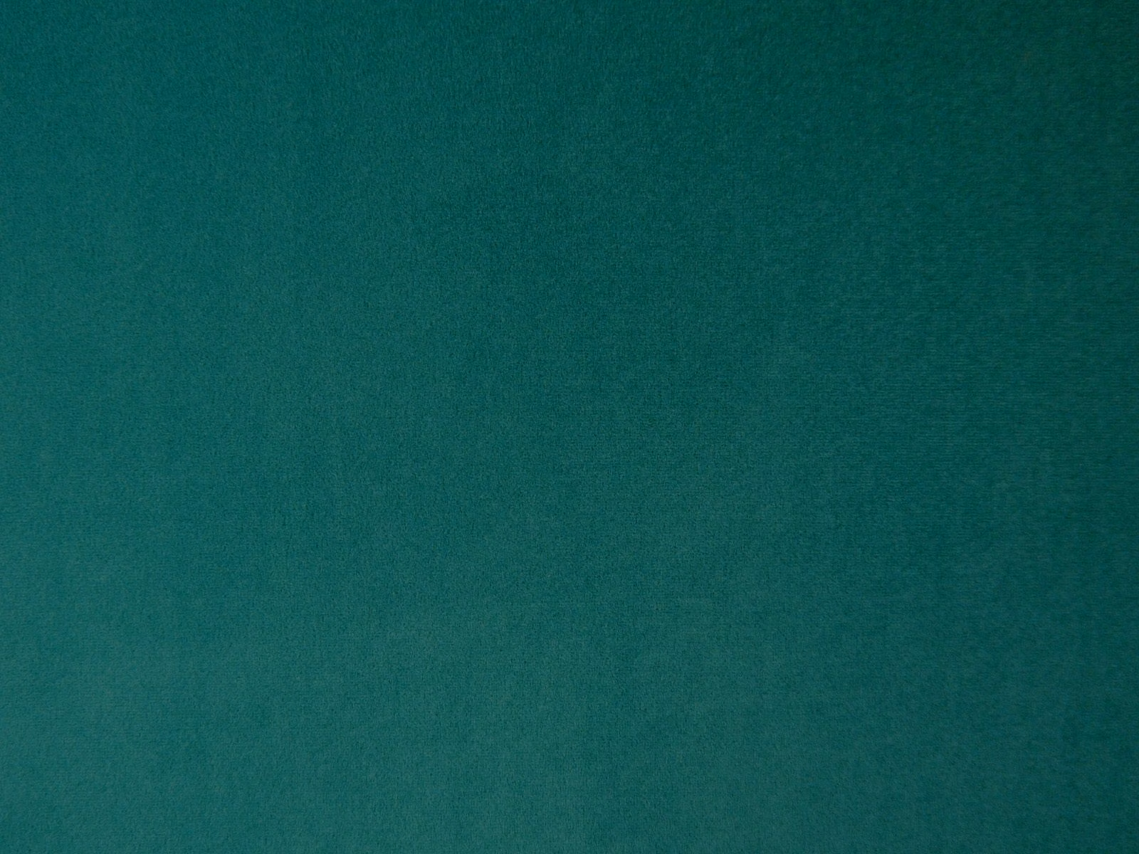 Deep teal plain velvet swatch showing soft tonal variation across its smooth pile