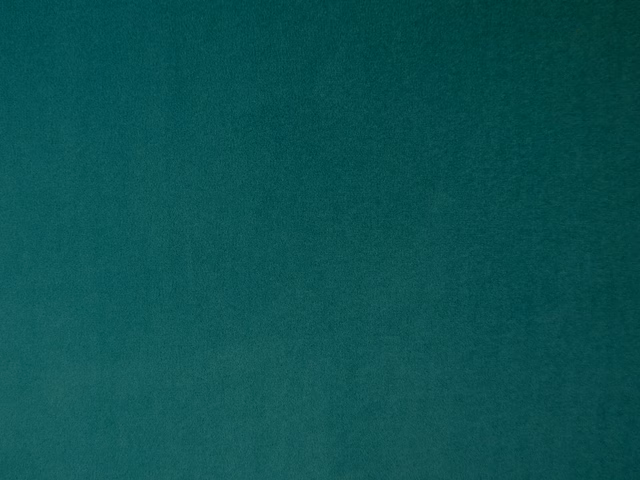 Deep teal plain velvet swatch showing soft tonal variation across its smooth pile