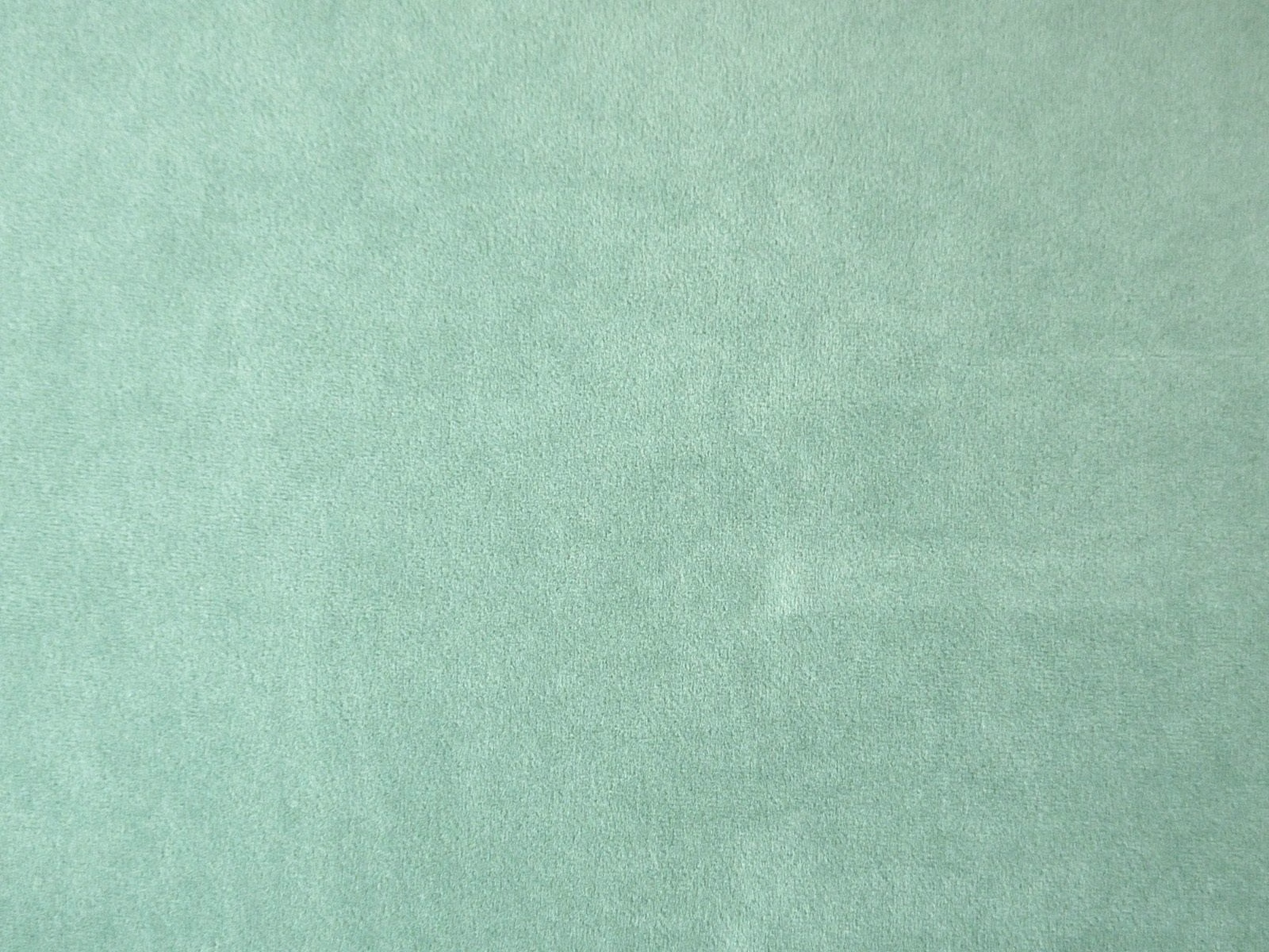 Pale mint-teal velvet with a softly mottled nap and plain surface