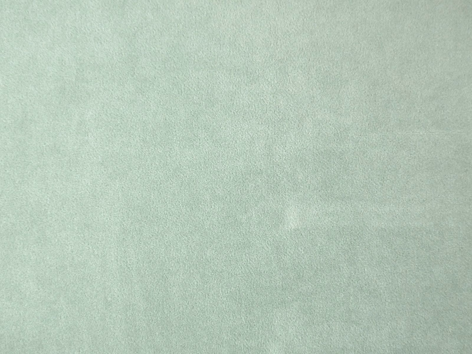 Pale mint-sage velvet swatch showing a softly mottled brushed pile