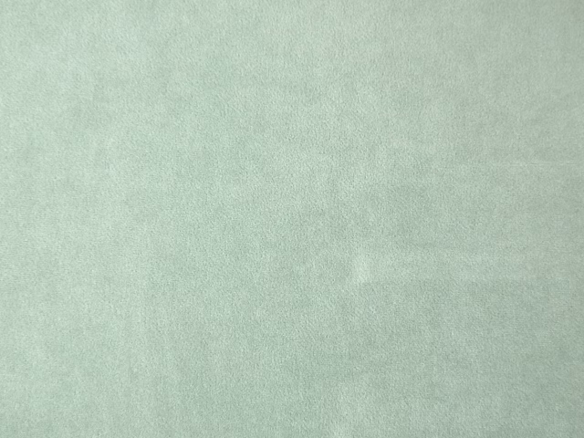 Pale mint-sage velvet swatch showing a softly mottled brushed pile