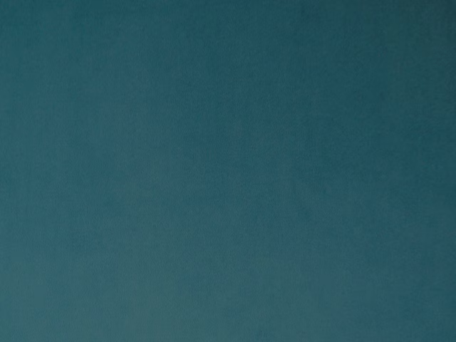 Deep blue-teal velvet with a softly mottled short pile catching the light