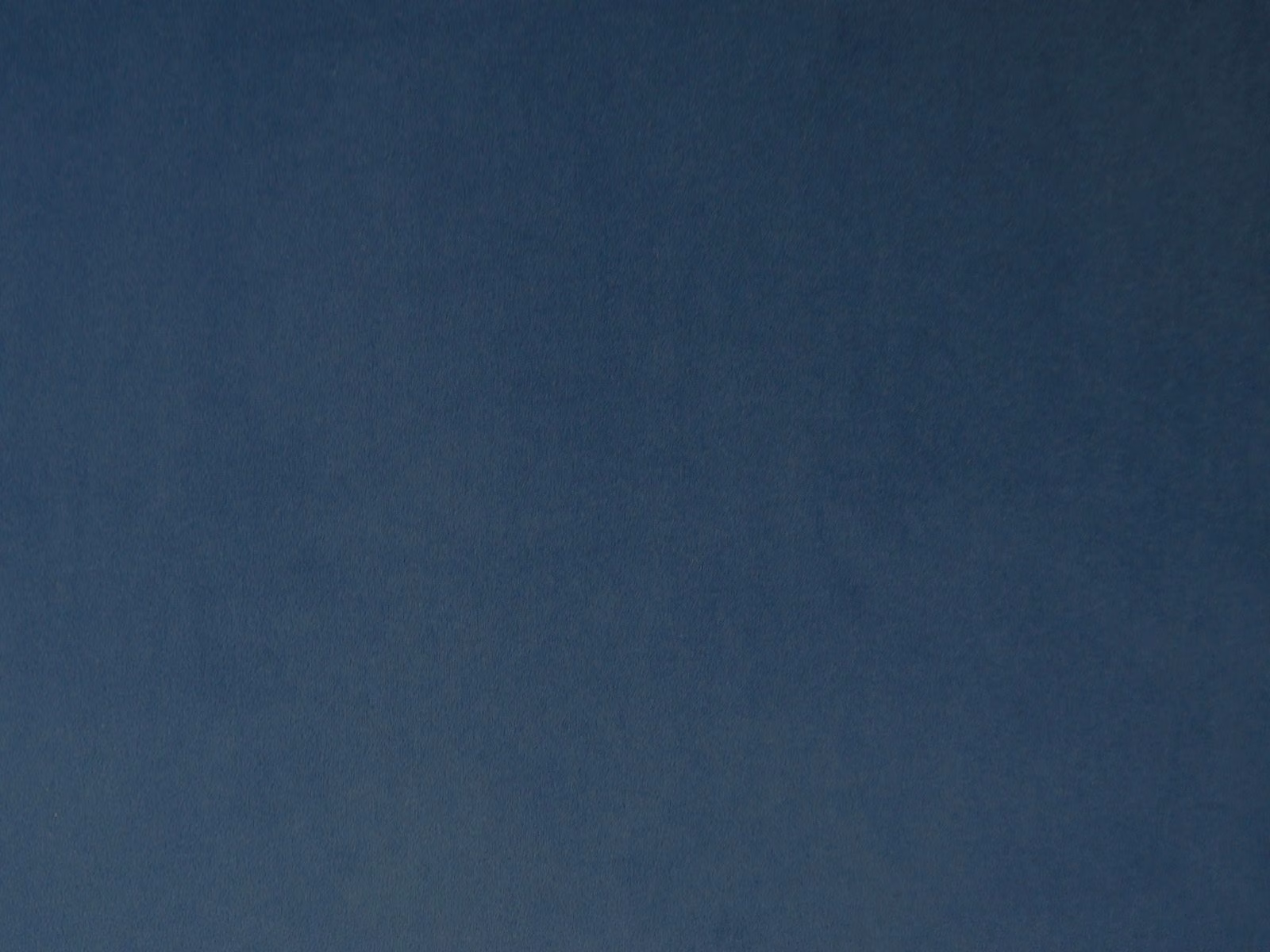 Deep petrol-blue velvet with a softly shifting, close-cut pile