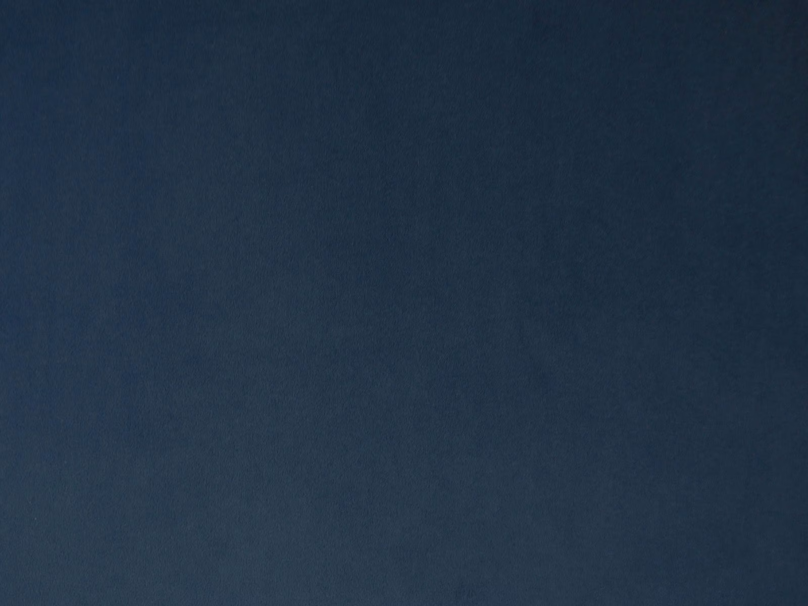 Deep navy-blue velvet with a soft, subtly shifting pile and plain surface